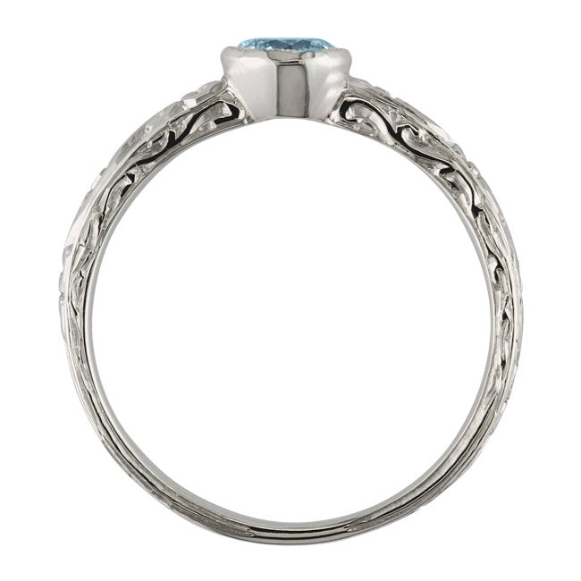 Rub-over set engraved aquamarine ring