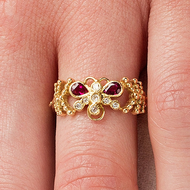 Ruby and diamond butterfly ring on hand