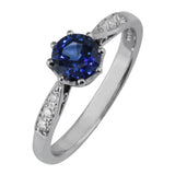 Sapphire engagement ring with diamond accent band