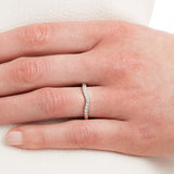 Shaped diamond wedding ring on hand